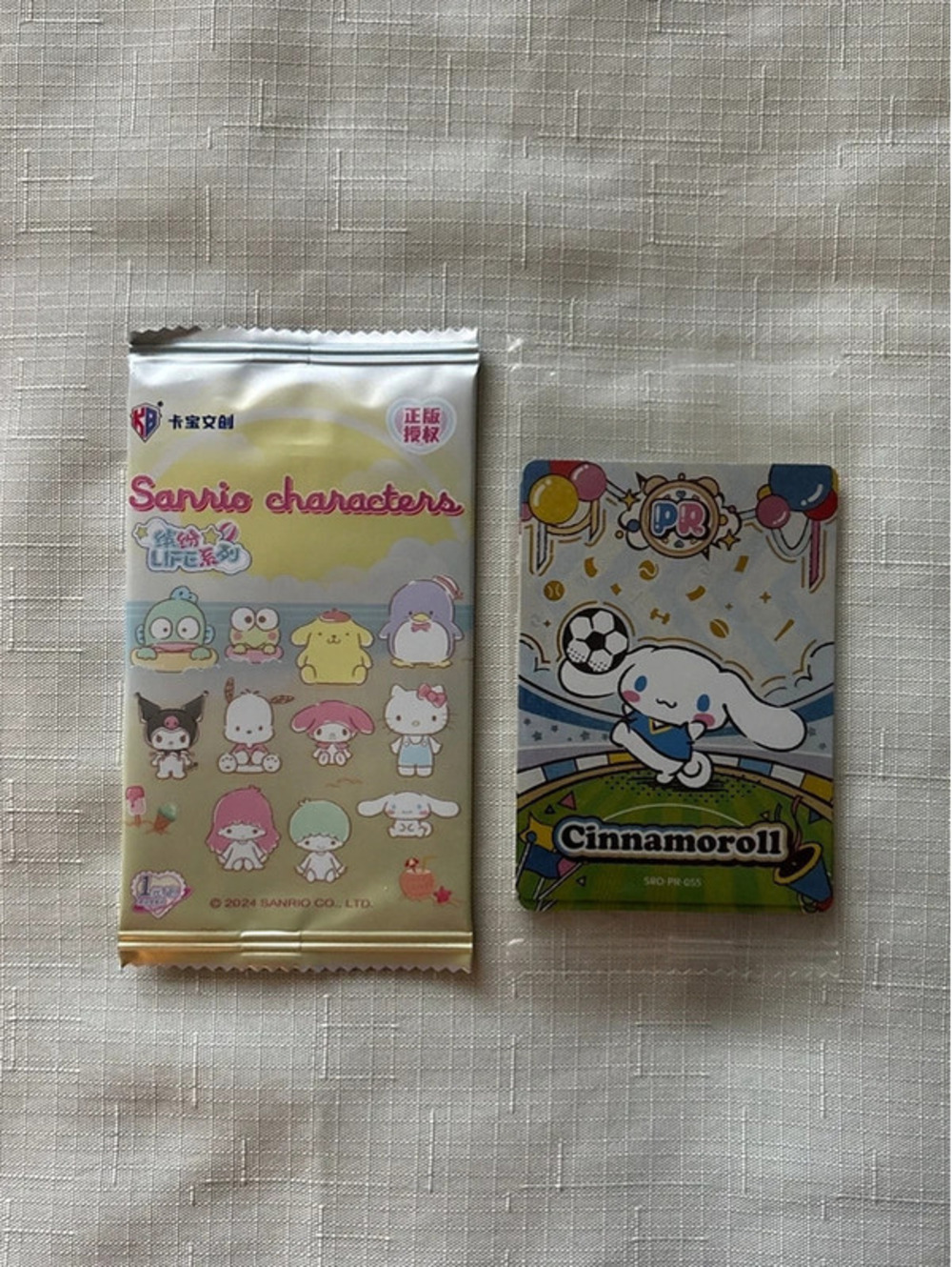 x1 Sanrio promo pack hit trading card + 1 sealed booster